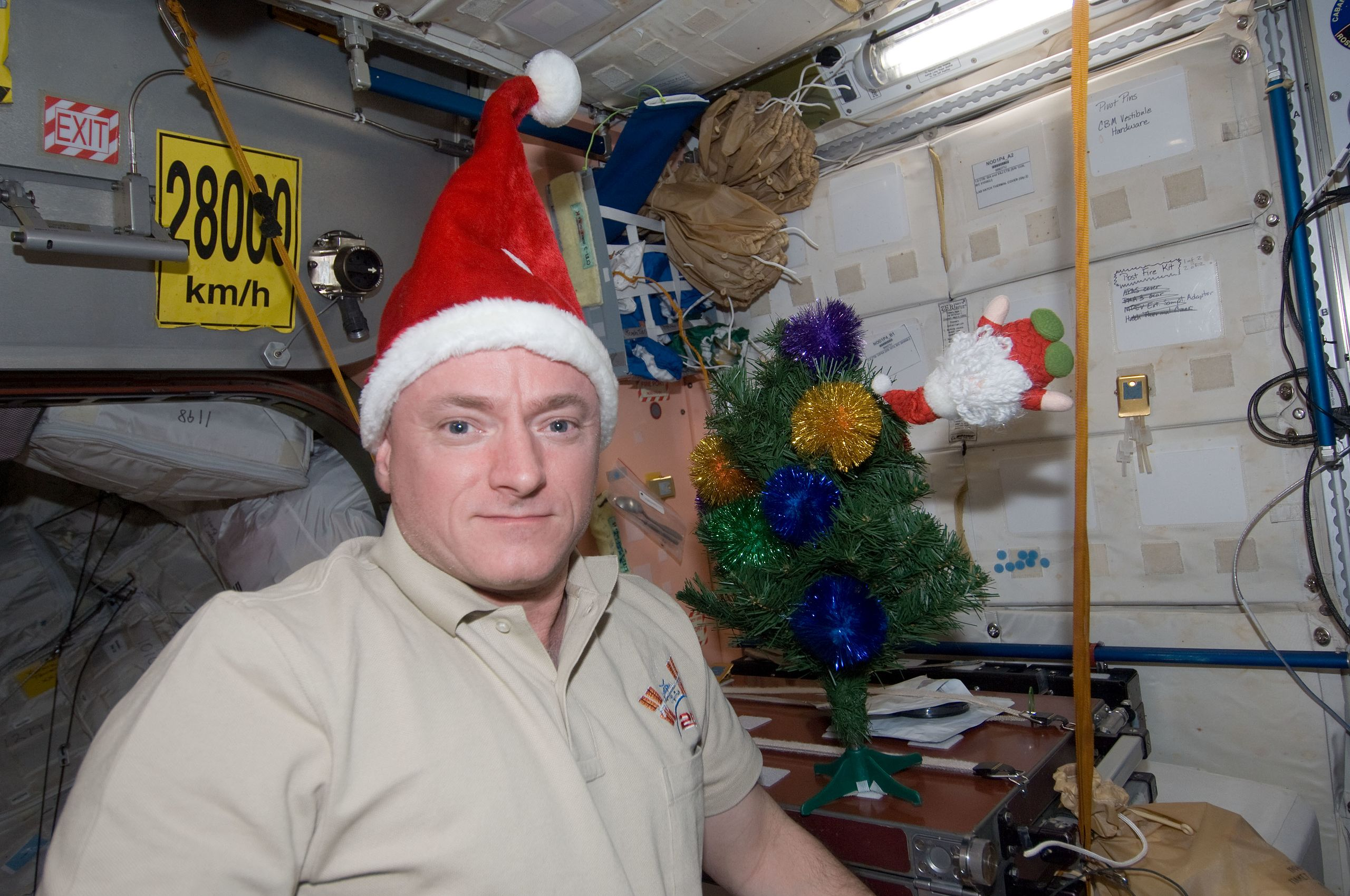 Astronaut Scott Kelly floating with festive socks in space