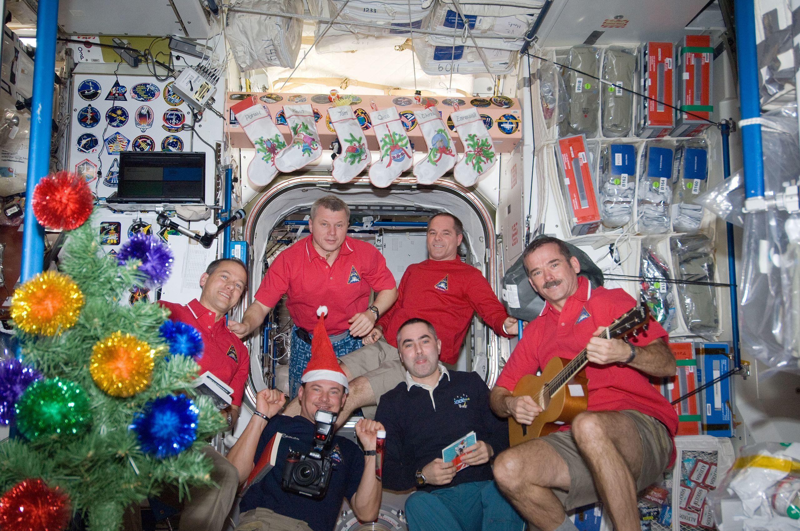 ISS crew members gathered for a holiday meal